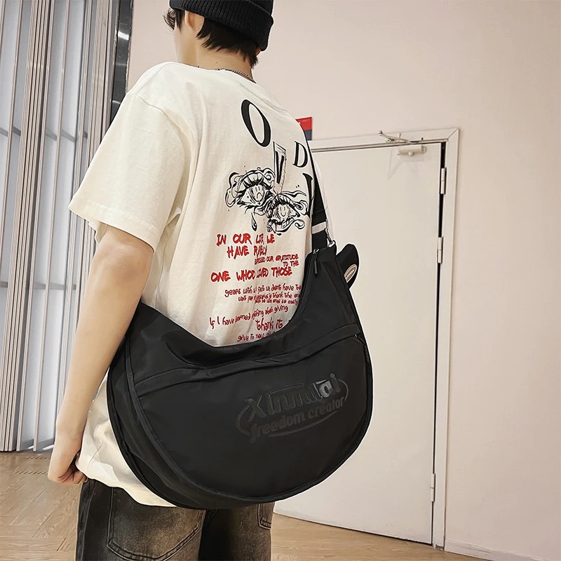 大牙饺子包男ins潮牌大容量单肩包休闲百搭斜挎包2023新款背包女