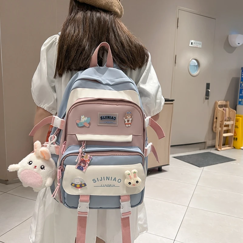 小学生书包女韩版一二3-6年级初中生轻便减负女生背包男生双肩包