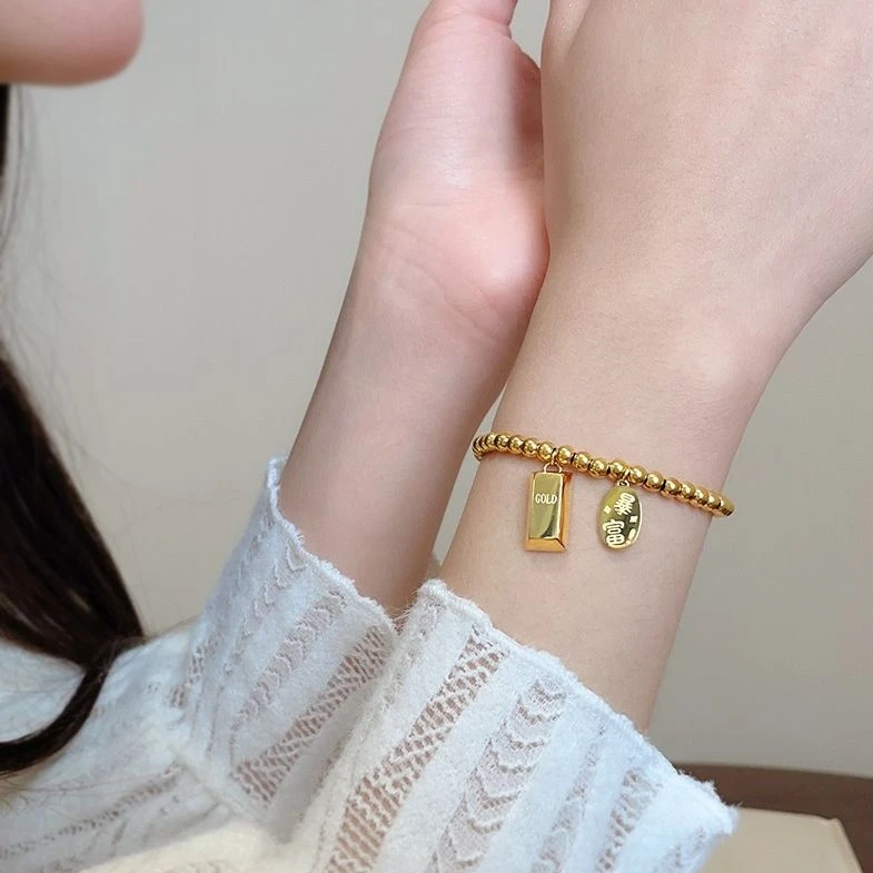 蒂芙妮官小金砖转运珠手链女款轻奢小众高级感18仿真黄金弹力钛钢