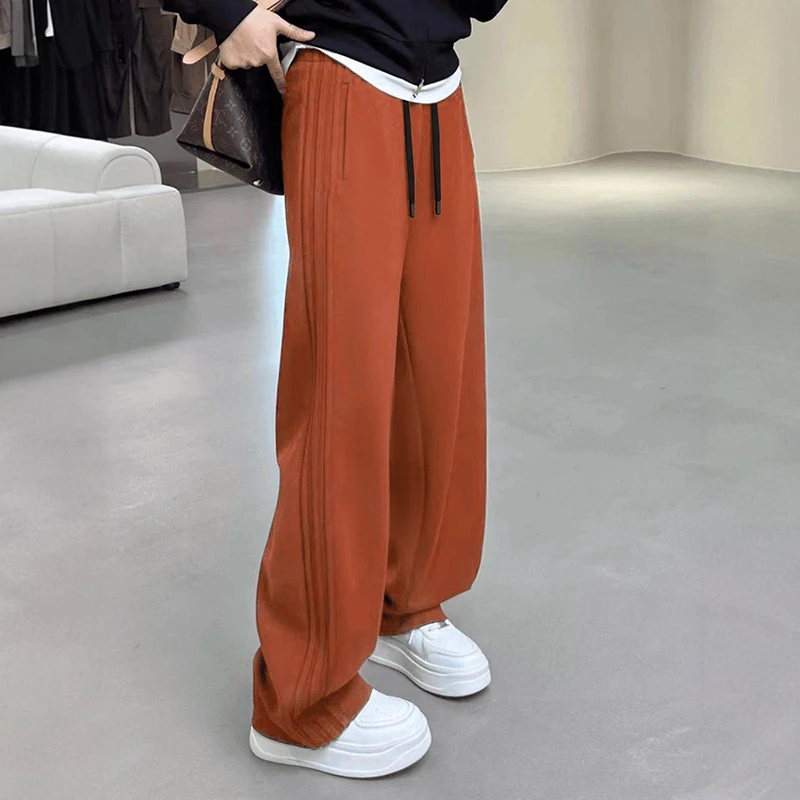 南瓜橘色休闲运动卫裤女春秋季2024新款宽松阔腿裤香蕉显瘦镰刀裤