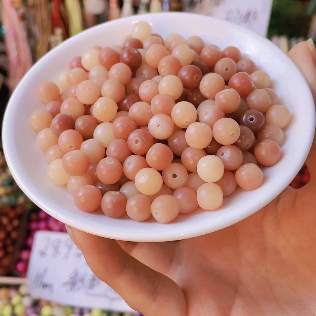 白玉菩提吊坠到手200颗。9*10粉色酒桶