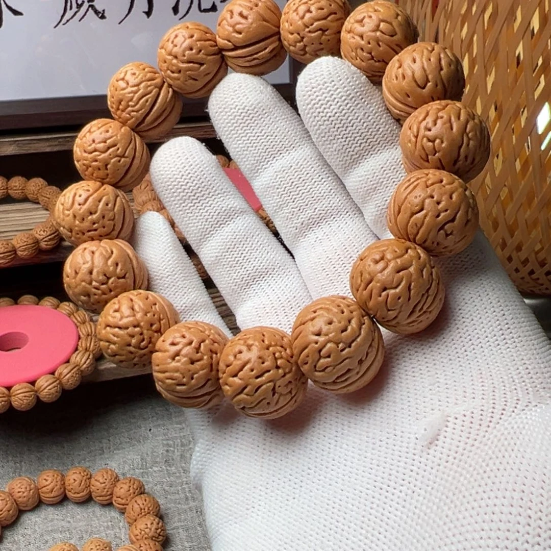 桃核手串最***格肉纹元宝