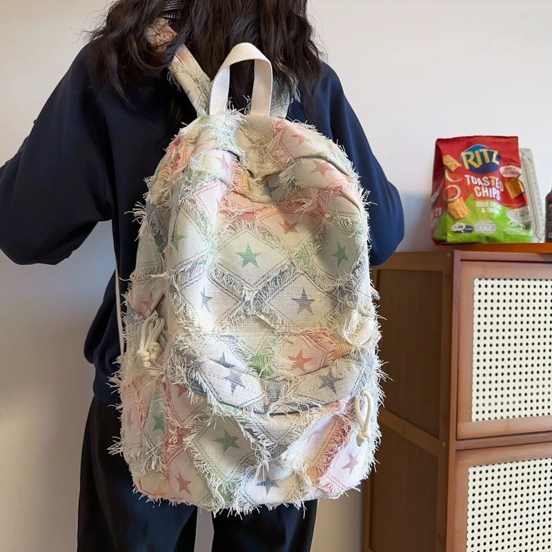 书包大学生小众设计破洞彩色时尚耐脏双肩包2024新款休闲旅行背包