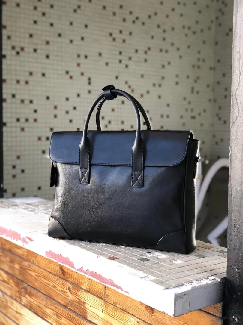 1996公文包头层牛皮..尺寸：40×9×29