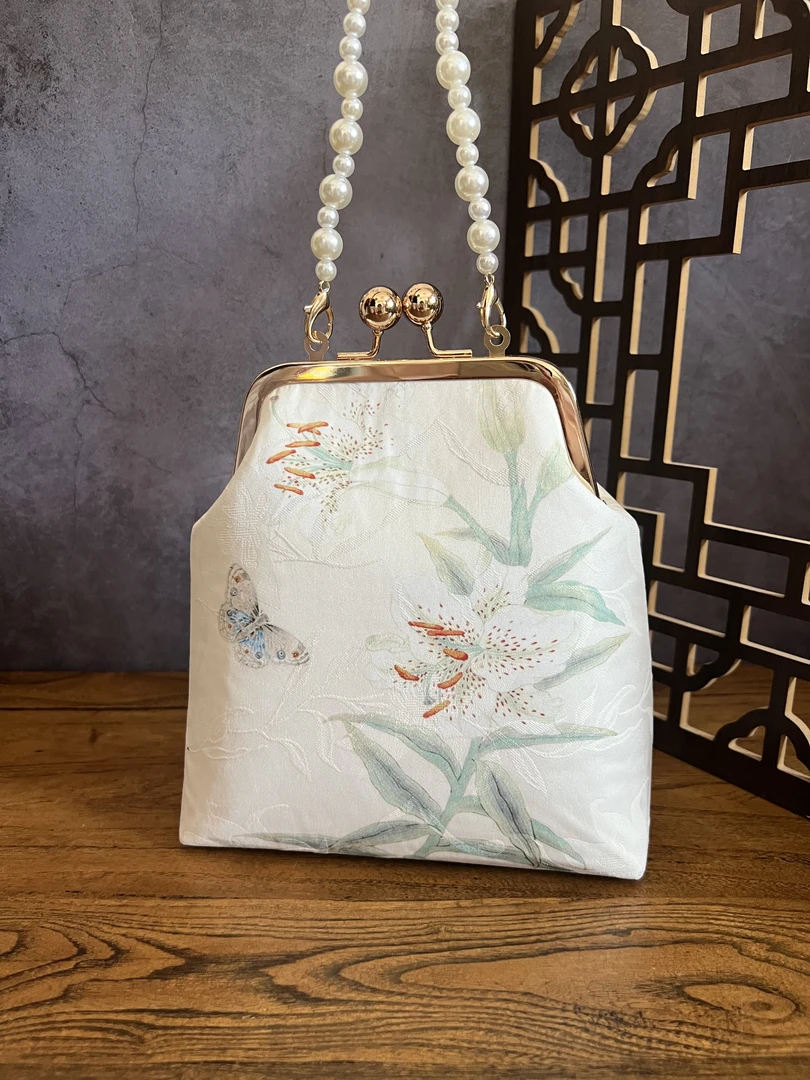 新国风白色清新缎面手提包珍珠手提斜挎包手机包新中式旗袍包优雅