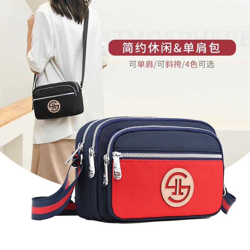 (1105-39)牛津布斜挎小包女百搭多隔层轻便时尚背包小巧实用女包