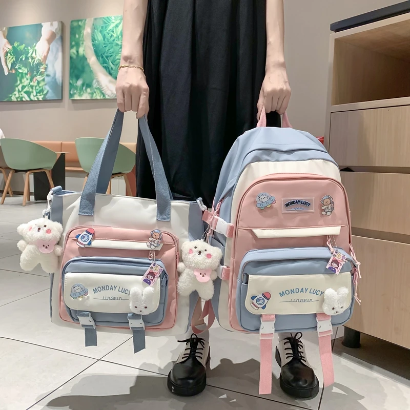 2022女学生书包新款韩版初中小学生原宿双肩包大容量装饰双肩背包