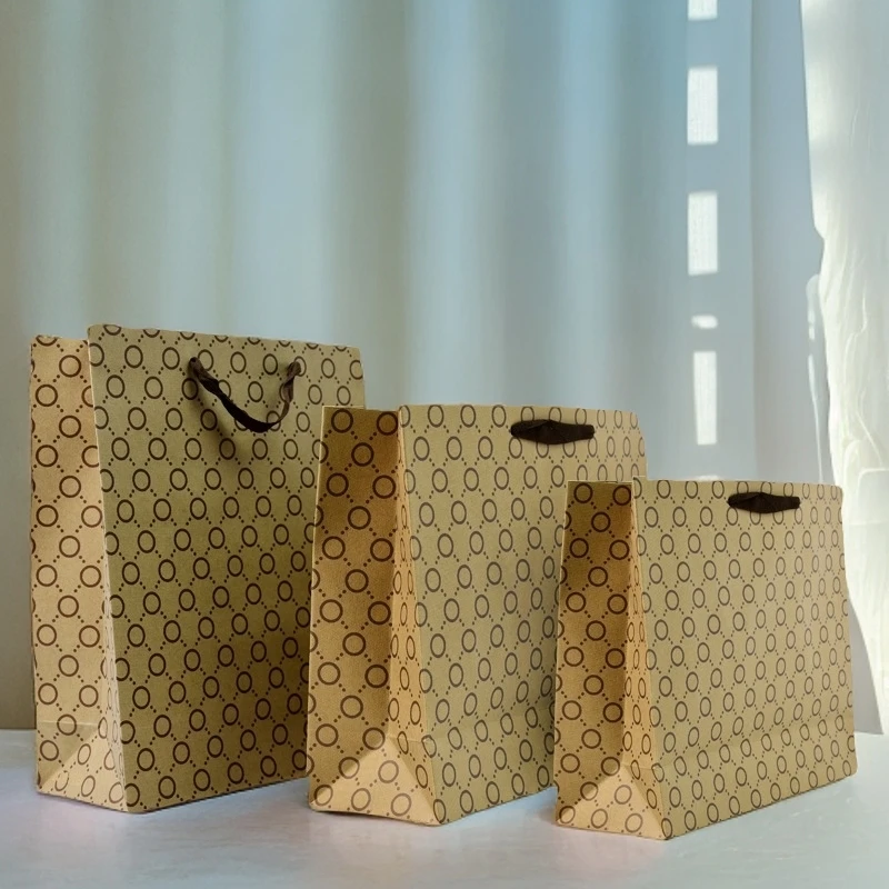 小圆圈通用牛皮纸手提袋纸袋批发服装袋购物包装纸袋茶叶礼品袋