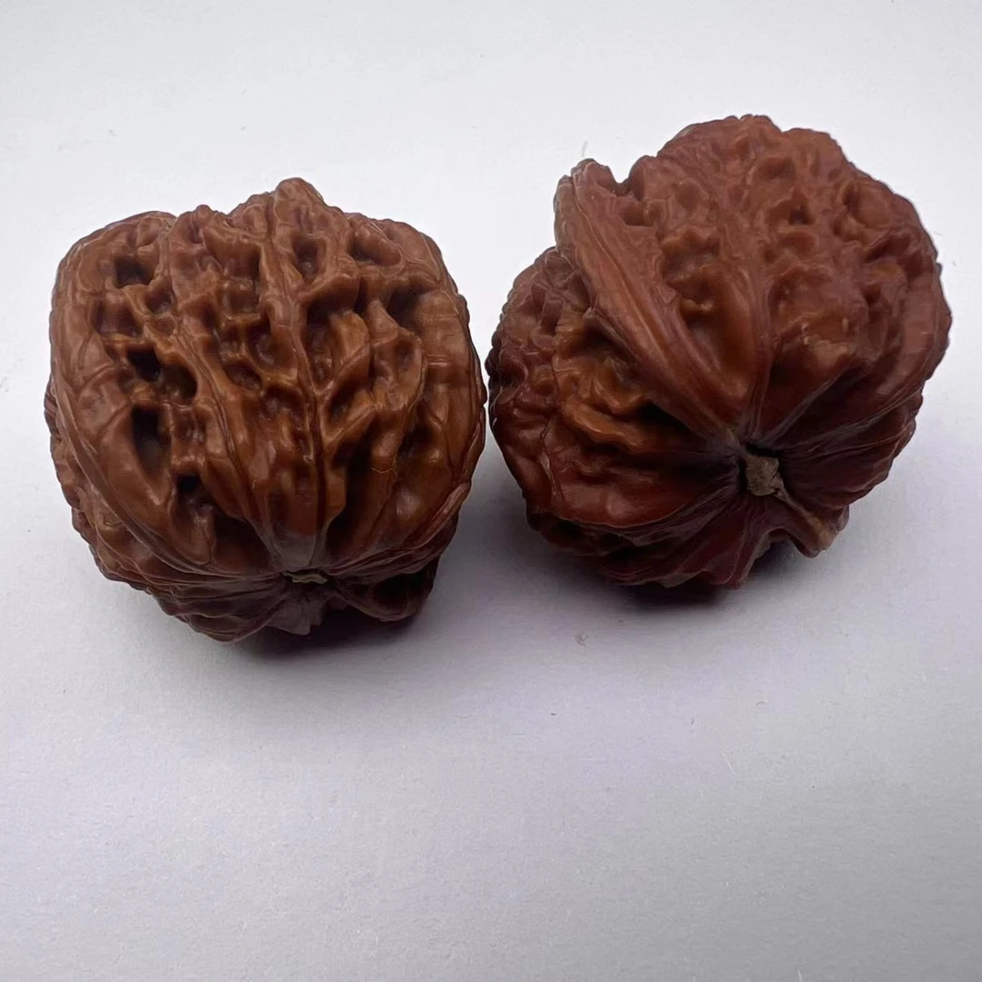 文玩核桃白狮子手盘500