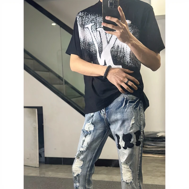欧美潮牌乞丐破洞牛仔裤男字母拼皮刺绣修身潮流小脚休闲百搭长裤