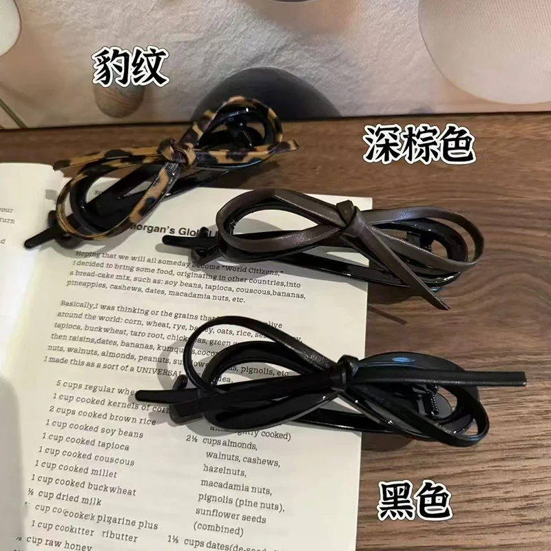 新品气质皮质蝴蝶结扭扭夹女后脑勺盘发高级感一字夹2024年新年