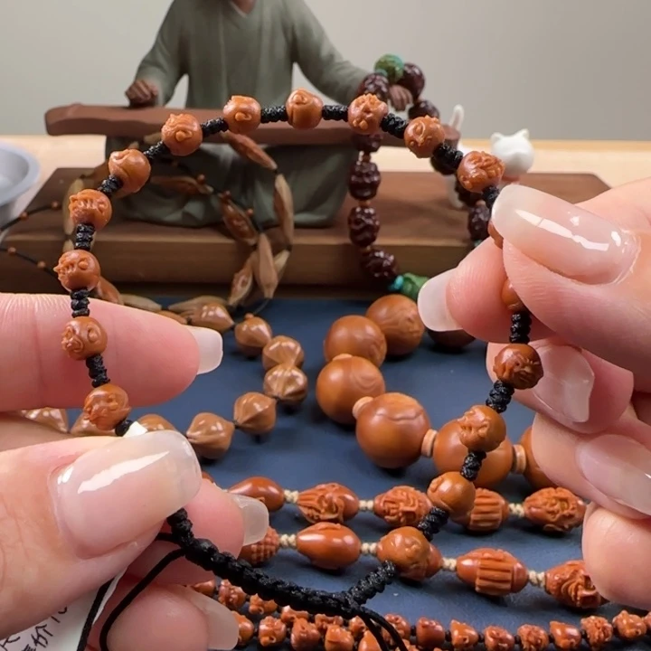 橄榄核核雕核尖手串