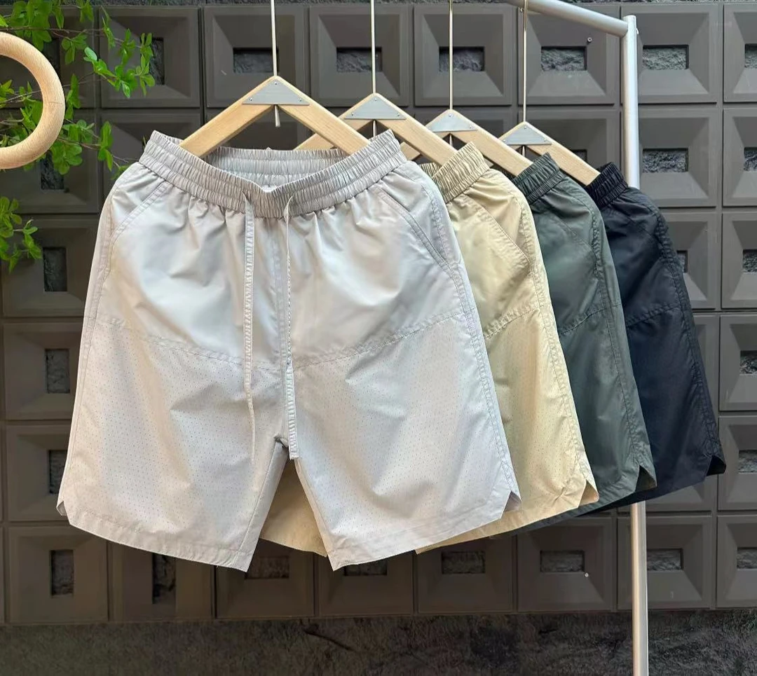 夏季新款速干百搭宽松休闲潮流薄款打孔男士运动时尚透气短裤D652