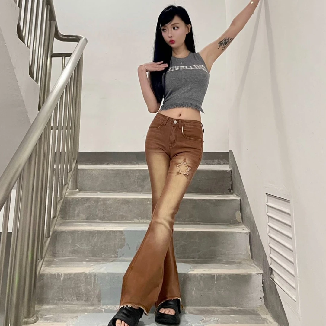 2023新款美式复古洗水毛边设计星星潮流弹力男女款牛仔长裤女9941