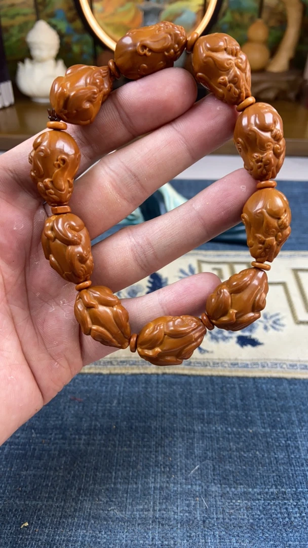 橄榄核雕十籽貔貅