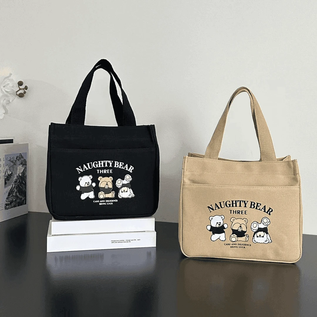 拉链外侧兜帆布手提包多口袋妈咪包学生便携饭盒包通勤女包零食包