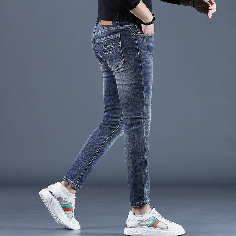 可啦可男装蓝色九分牛仔裤男潮牌修身小脚时尚高端百搭休闲男裤子