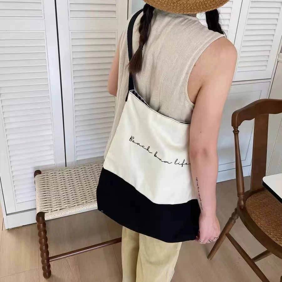 新品原创小众设计黑白拼接慵懒百搭休闲单肩流浪托特学生帆布包潮