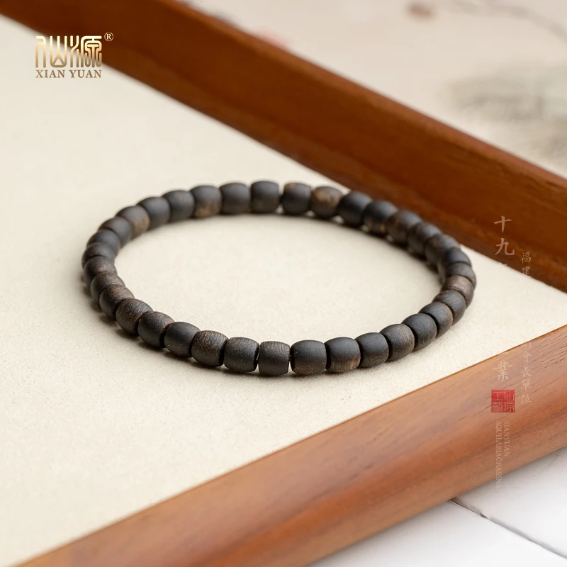 莺歌绿奇楠沉水沉香5*5mm35颗鼓珠单圈手串素串