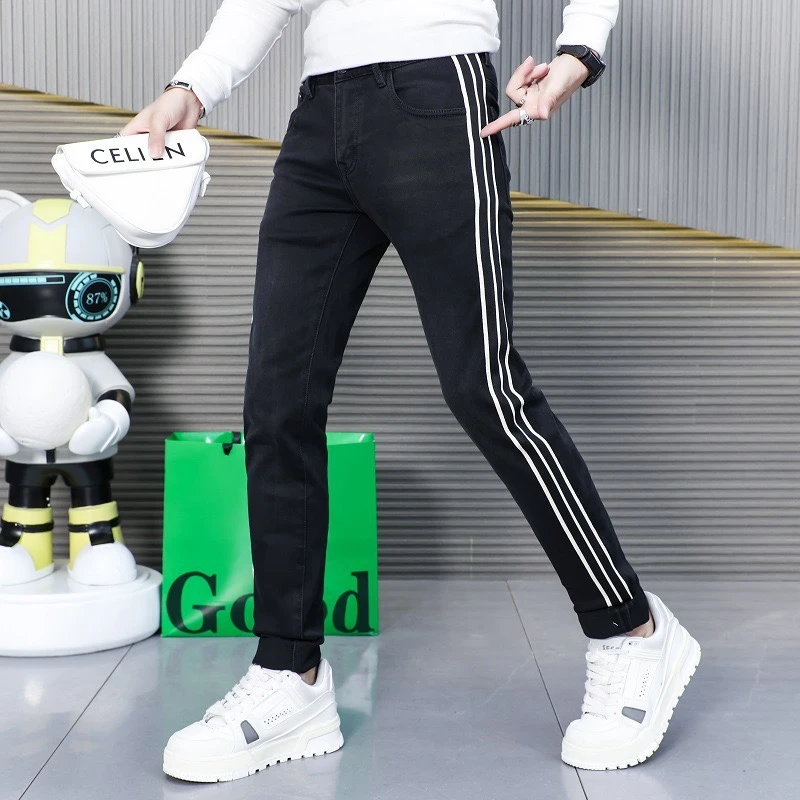 2024秋冬新款男士修身个性侧边条纹织带拼接黑色牛仔裤潮牌小脚裤