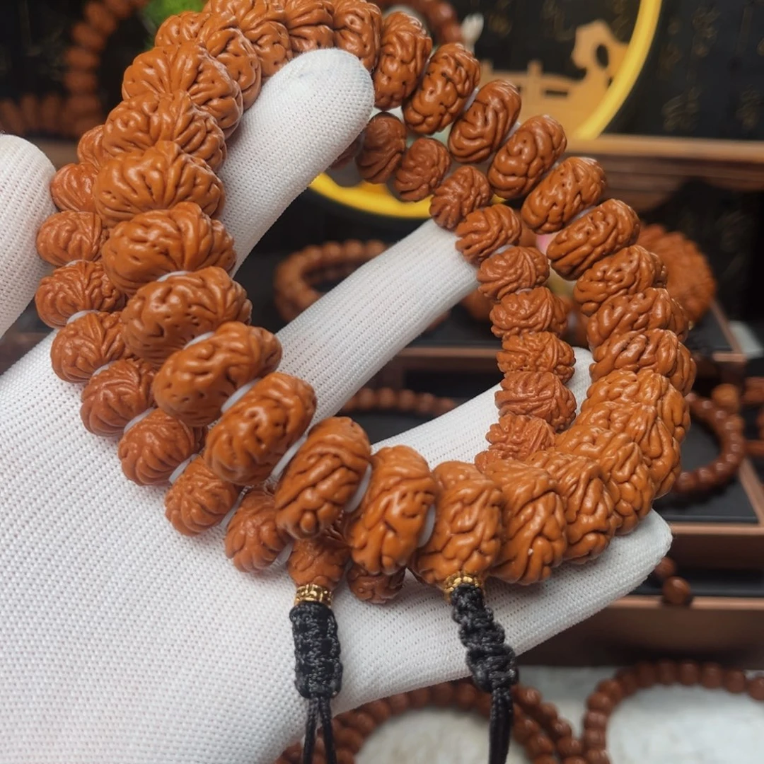 桃核手串西***子飞碟金蝉手持金鱼眼飞碟手持