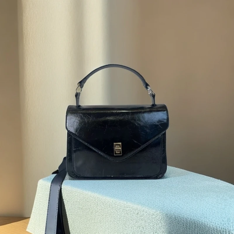 525时尚女士大信封包-头层油蜡牛皮