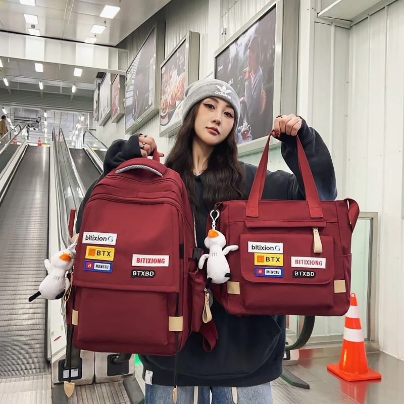 书包女生大学生高中学生酒红色背包初中生小学生大容量减负双肩包