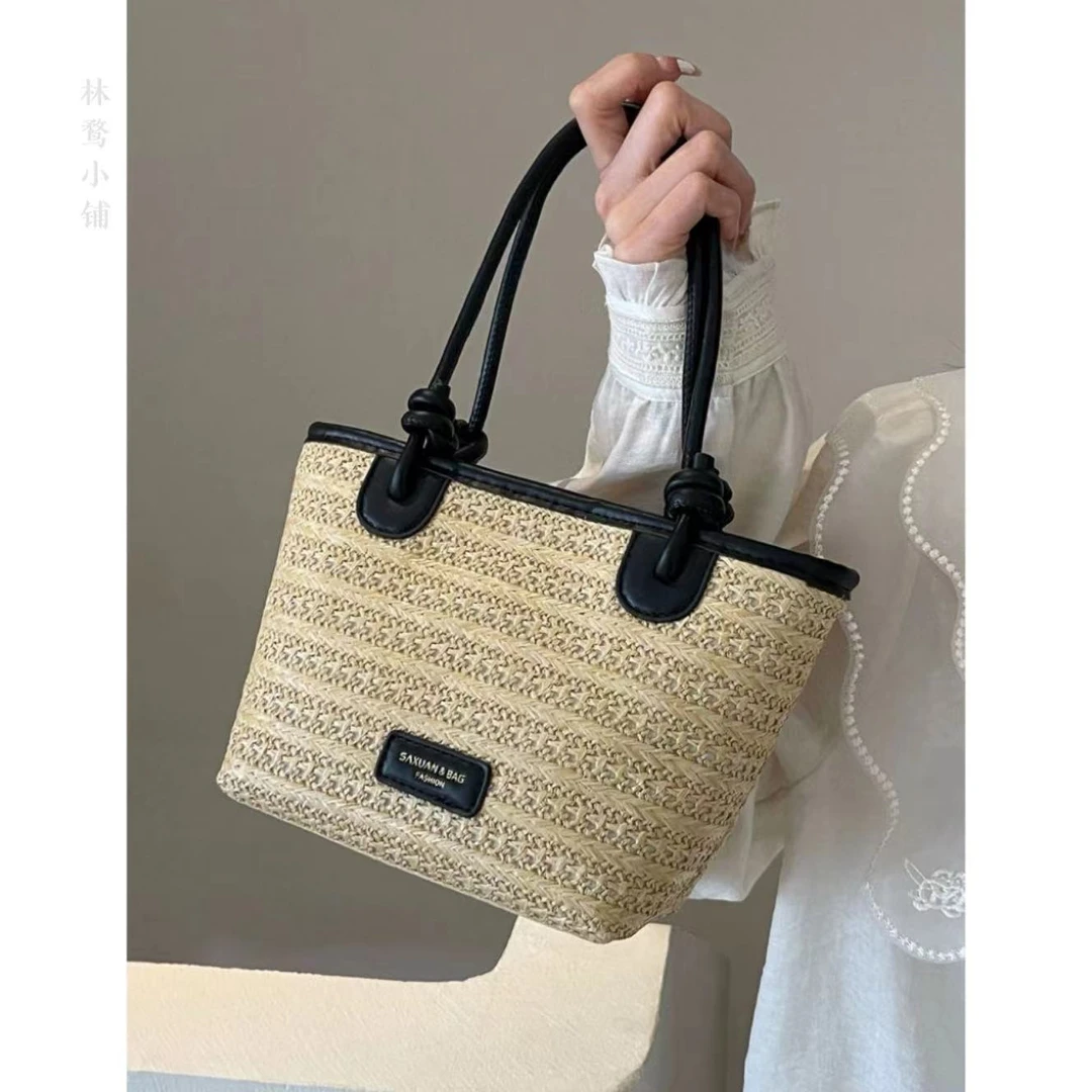 通勤夏季新款沙滩度假风编织包包女肩斜挎包菜篮子水桶草编包休闲