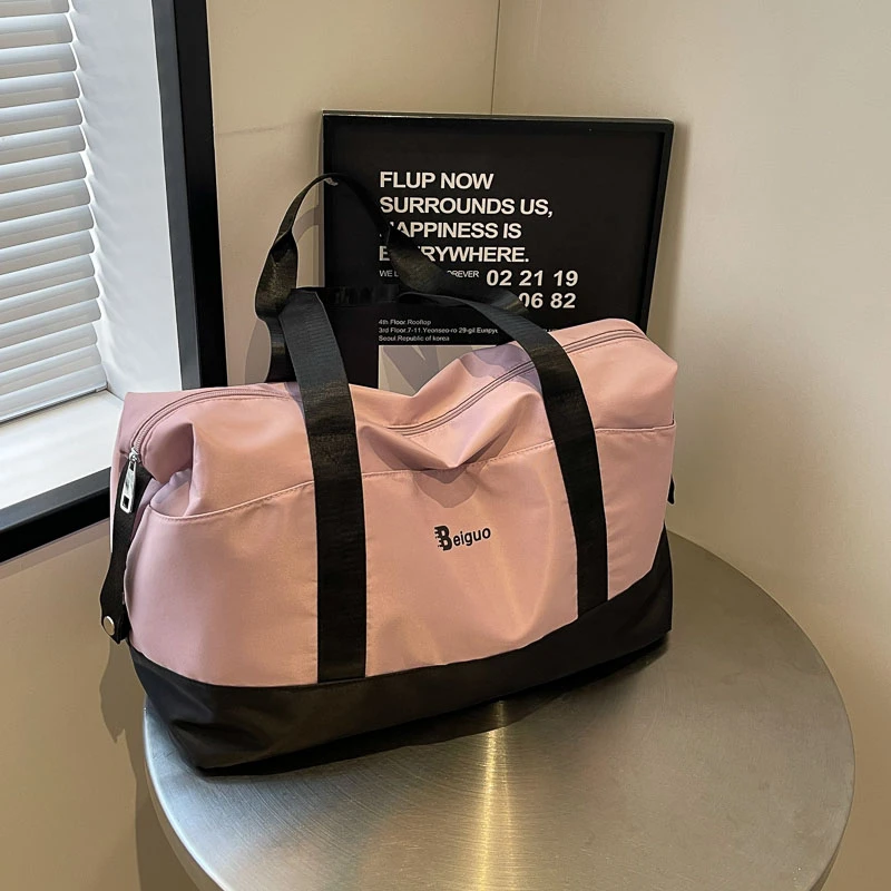 大容量手提短途旅行包女士可折叠学生拉杆行李包男登机待产收纳袋