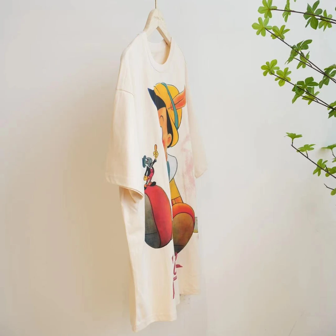 9587-杏色卡通木偶人印花夏季宽松休闲圆领短袖T恤