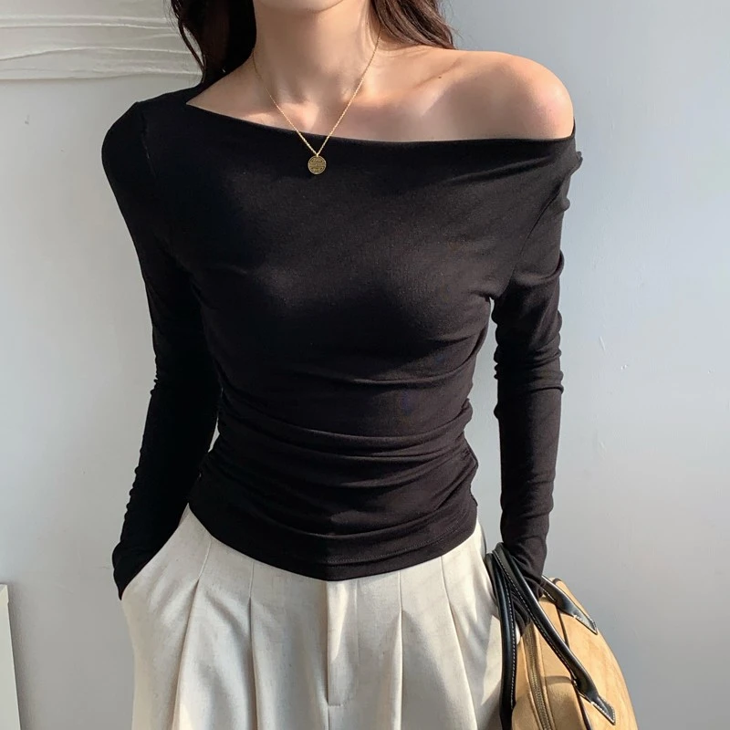 秋冬季斜肩一字领长袖T恤女纯欲风下摆弧度修身气质短款露肩上衣