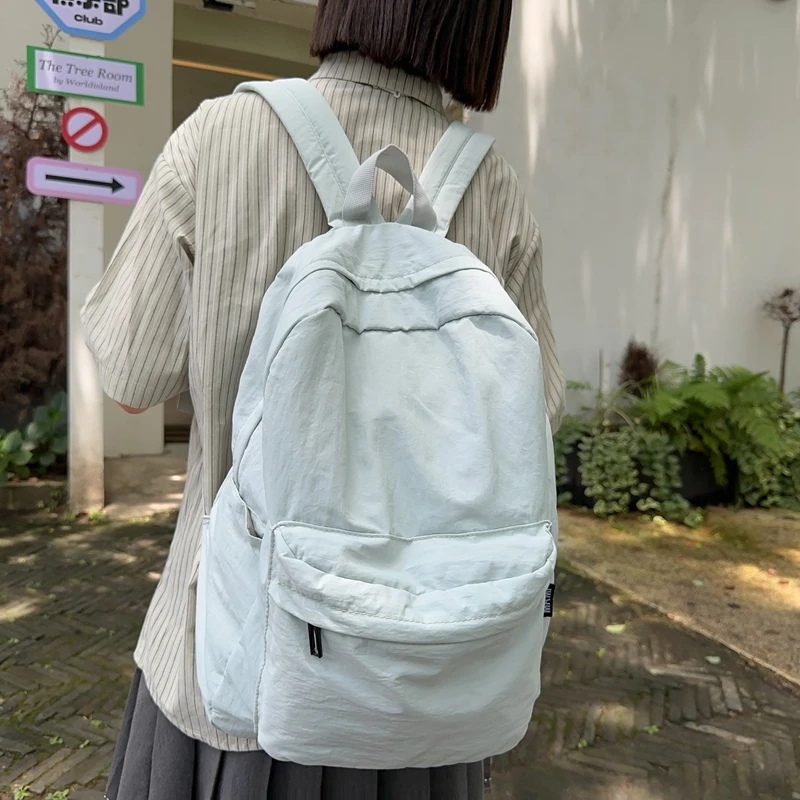 简约大学生双肩包女旅游轻便防水背包初中生高中生书包男女大容量