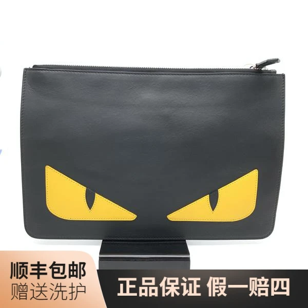 95新 FENDI/芬迪 芬迪黑色黄眼睛手拿包/10014990经典休闲男士
