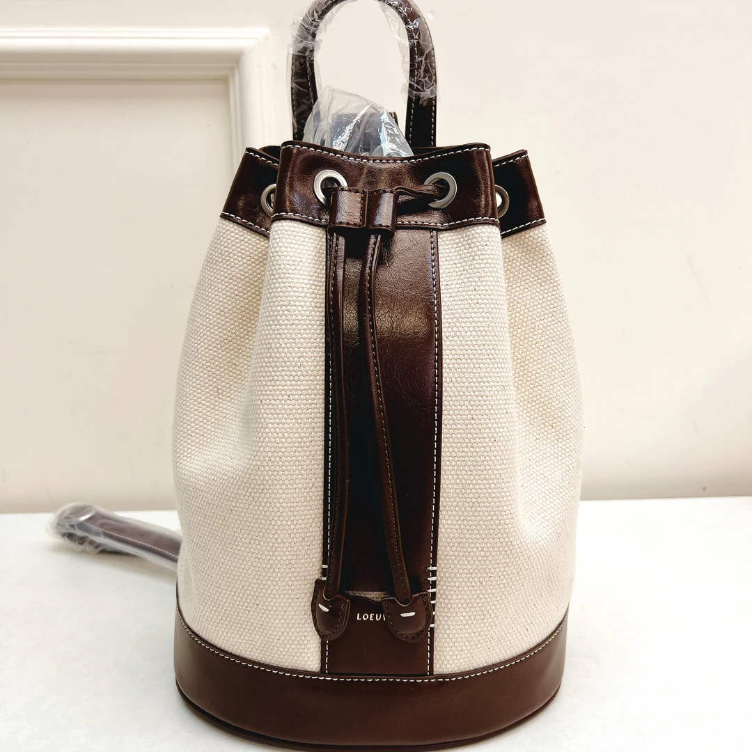 50934 LOEU韩VRE版，咖色牛皮+帆布单肩斜背水桶包，尺寸：32x23cm