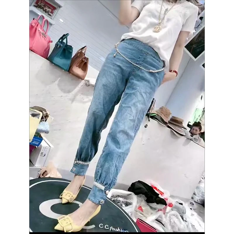 M9A80254 裤子女显瘦百搭欧洲秋夏季潮时尚重工钉珠牛仔收脚长裤