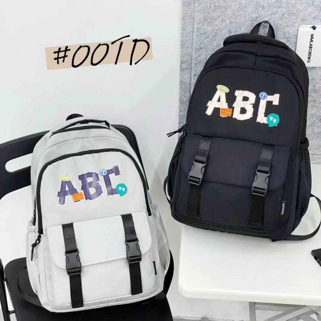 男女防水轻便字母双肩背包ins时尚大学生初中双肩包休闲潮流潮酷