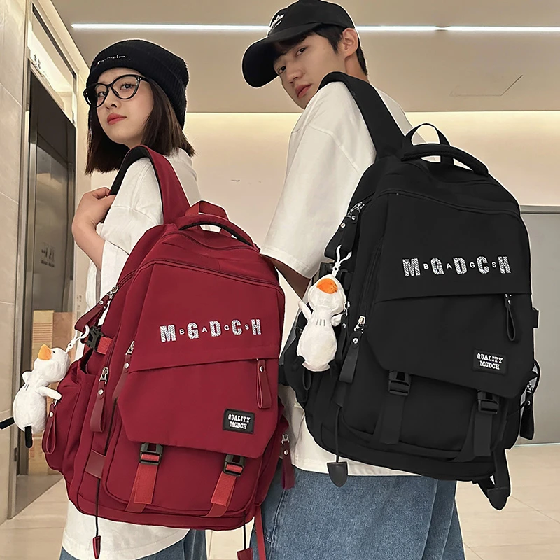 休闲旅行大容量书包男士高中学生双肩包女款初中生大学生通勤背包