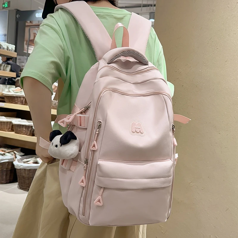 高颜值书包初中女生减负护脊背包高中生大容量大学生休闲双肩包女