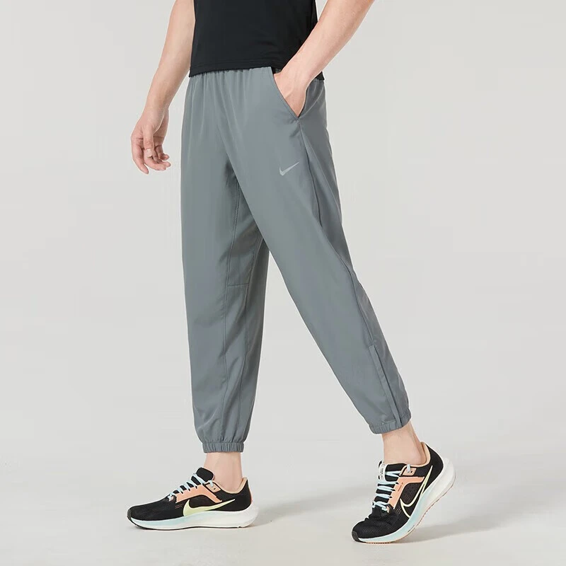 NIKE/耐克男士裤秋季新款透气跑步运动裤束脚休闲九分梭织长裤