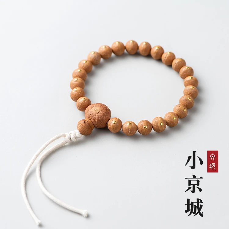 尼泊尔凤眼菩提镶嵌金黄锭实心籽