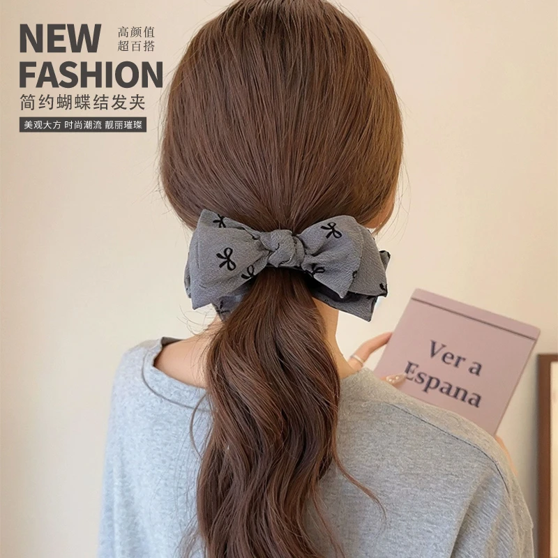 爆款优雅设计感蝴蝶结丸子头时尚女感盘发高马尾抓夹头饰2024新款