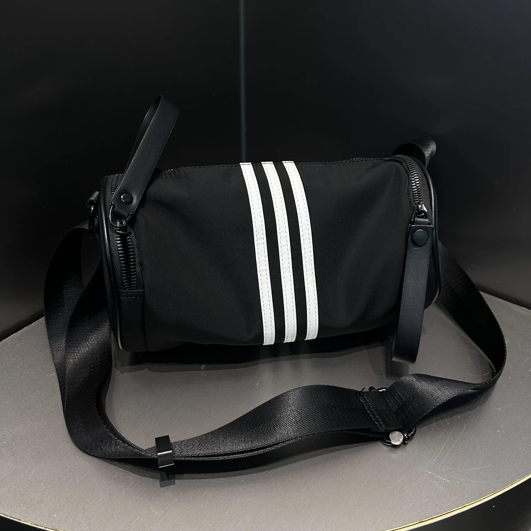 C259潮牌百搭斜挎包新款防水尼龙三条杠休闲圆筒包女大容量枕头包