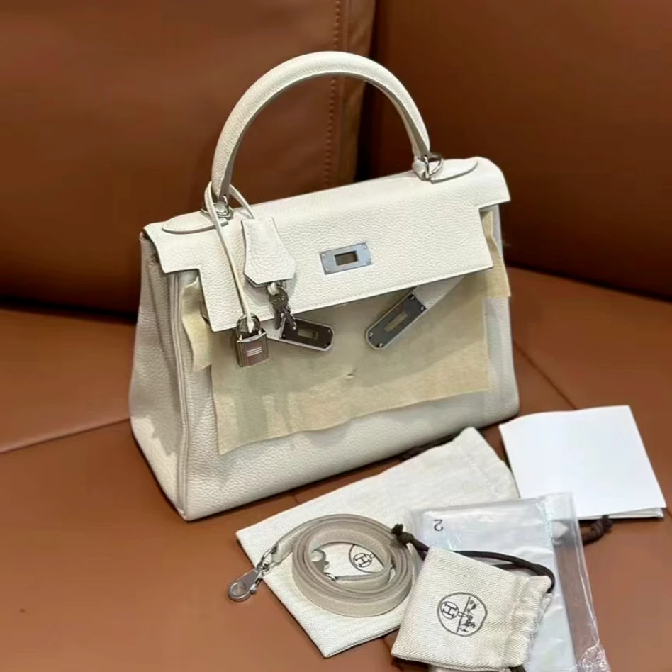 99新 Hermes/爱马仕 小花6欢 kelly 28 奶昔白 togo皮 A刻 银扣包