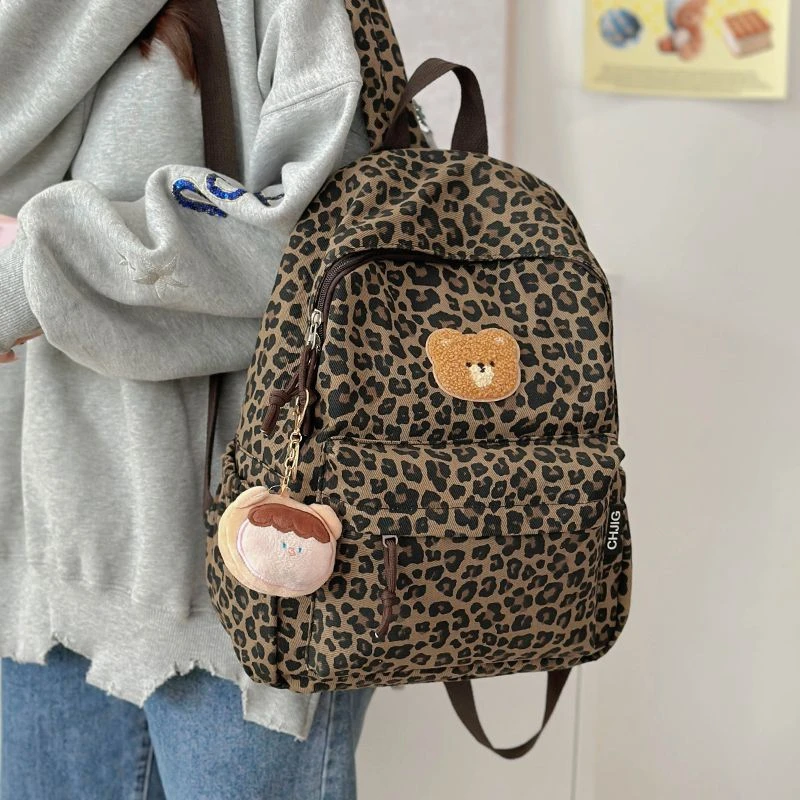 书包初中女生大学生ins小众豹纹双肩包女2025新款旅游轻便背包潮