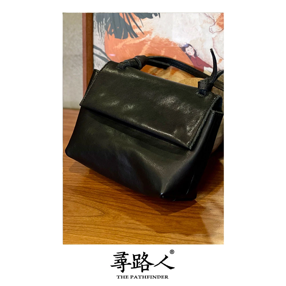寻路人休闲女士真皮大气款简约百搭实用斜挎包绑绳包