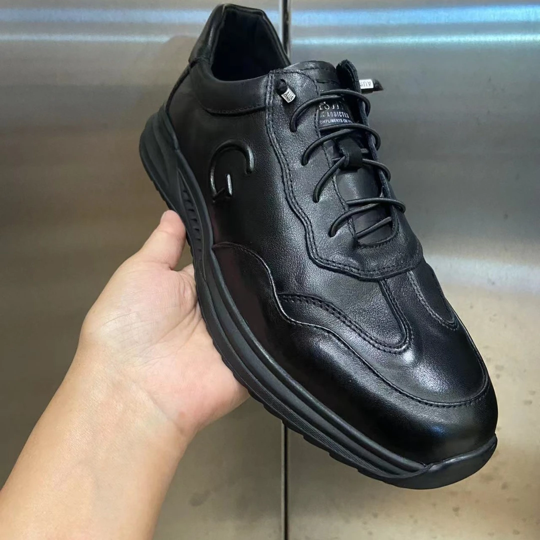 新款纯色黑色时尚百搭真皮潮流韩版橡胶休闲板鞋LE66981