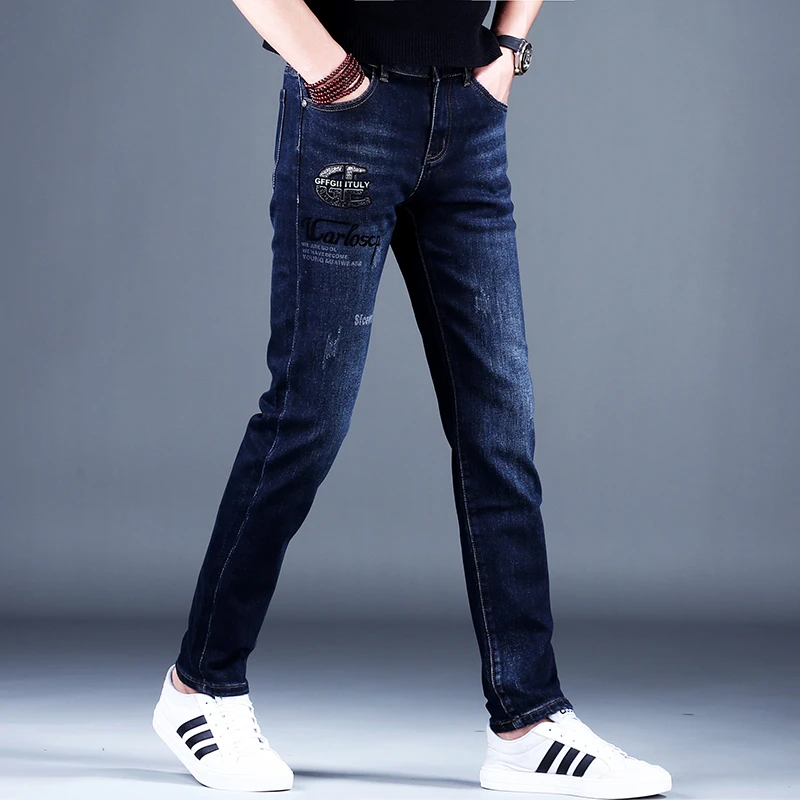 男士蓝色印花牛仔裤男款秋冬款新款潮牌百搭高端时尚裤子修身小脚