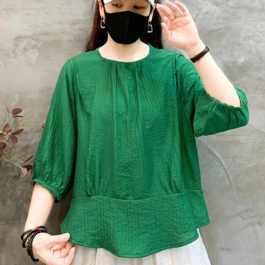 2023年早秋新款个性洋气显瘦百搭中袖圆领单排扣小衫气质女士上衣