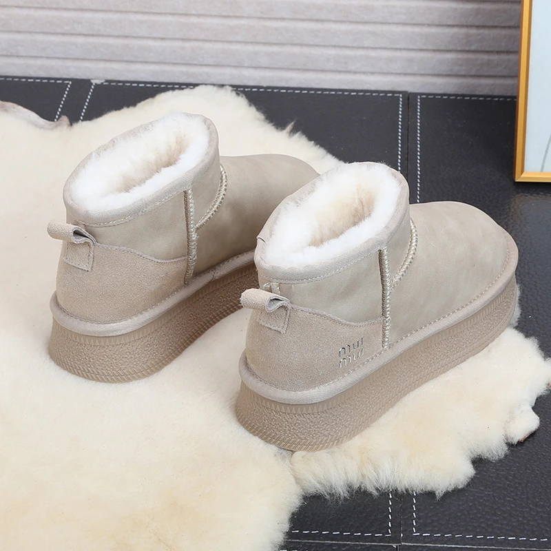 防水牛皮羊毛雪地靴女2024冬新款百搭厚底一脚蹬东北防滑短靴棉鞋