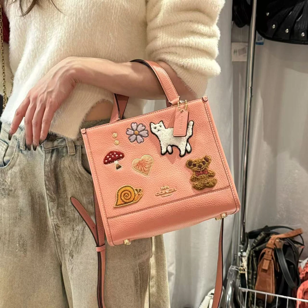 99新 COACH/蔻驰 辣辣/巨可爱皮皮拼接老花手提斜挎包